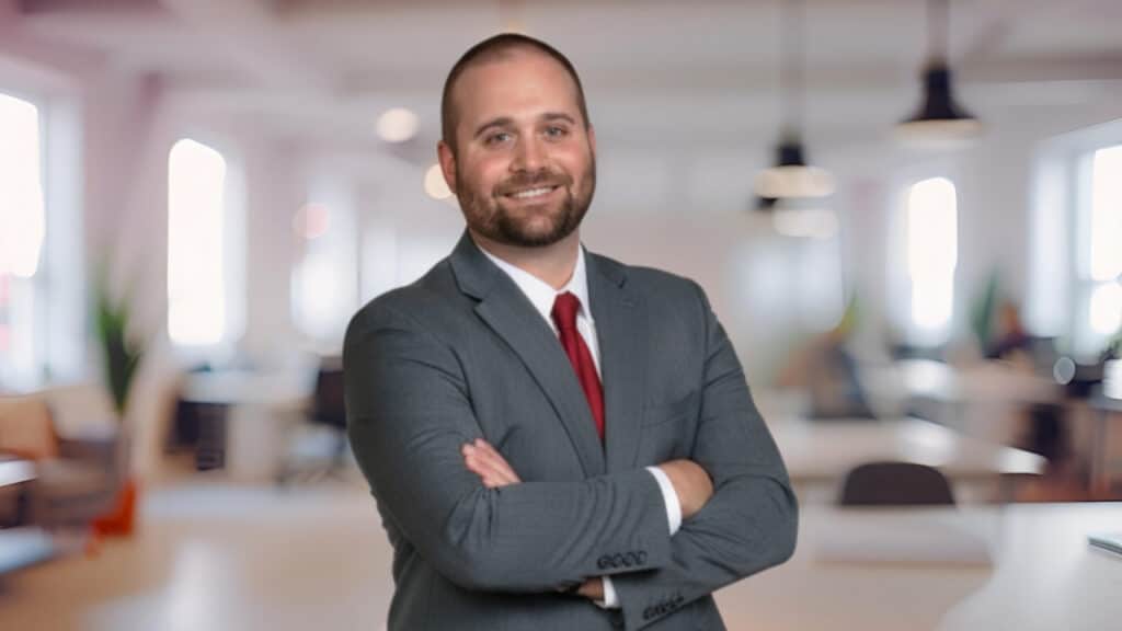 Headshot of Justin Mika, real estate agent.